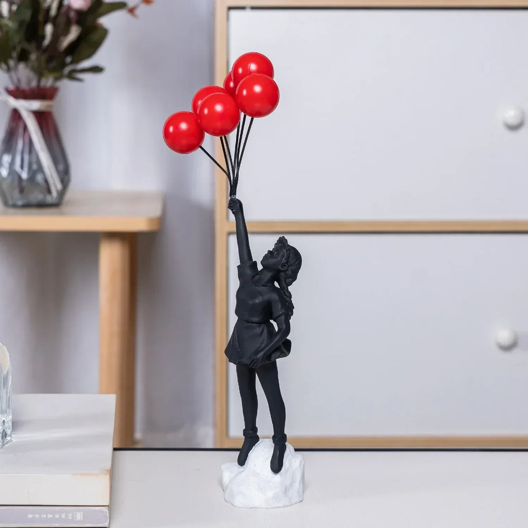 Skulptur af en pige med ballon i Banksy-stil til borddekoration og kreativ stueindretning