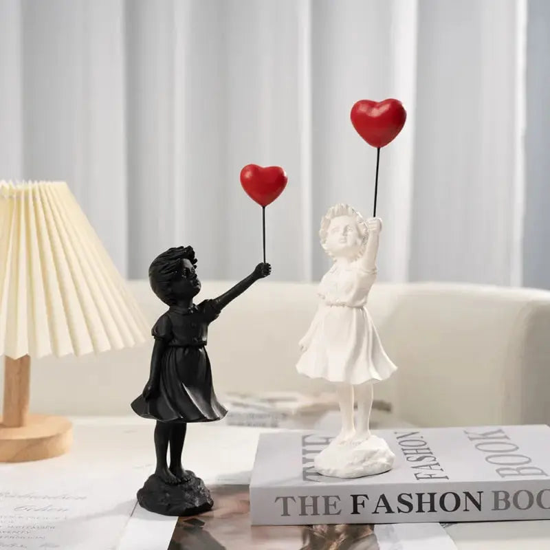 Banksy flyvende Ballonpige Statue
